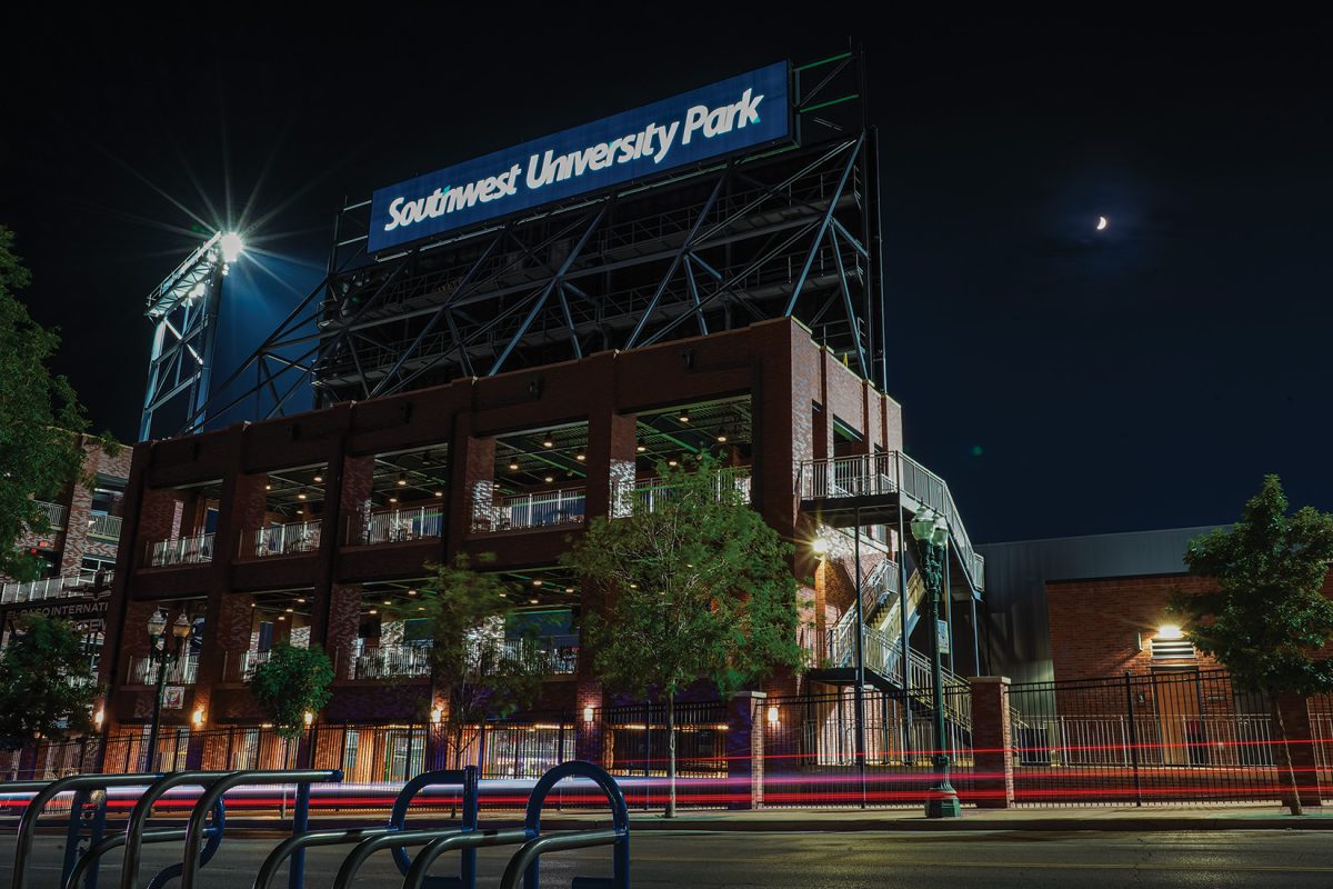 Street filled with bright lights from southwest university park.