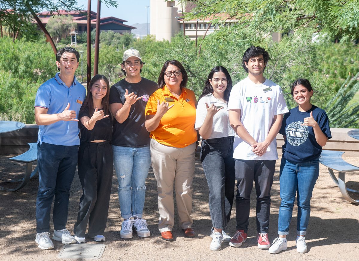 UTEP+Career+Center+Director%2C+Betsabe+Castro-Duarte%2C+poses+with+her+fellow+employees+of+the+Career+Center.+