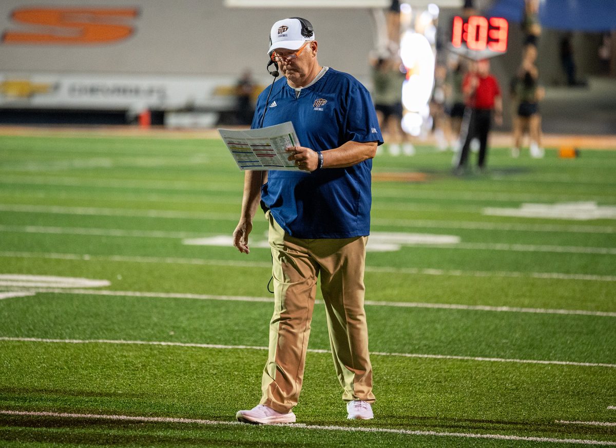 UTEP football head coach Dana Dimel looks down at his play sheet during a game against UNLV Sept. 23.