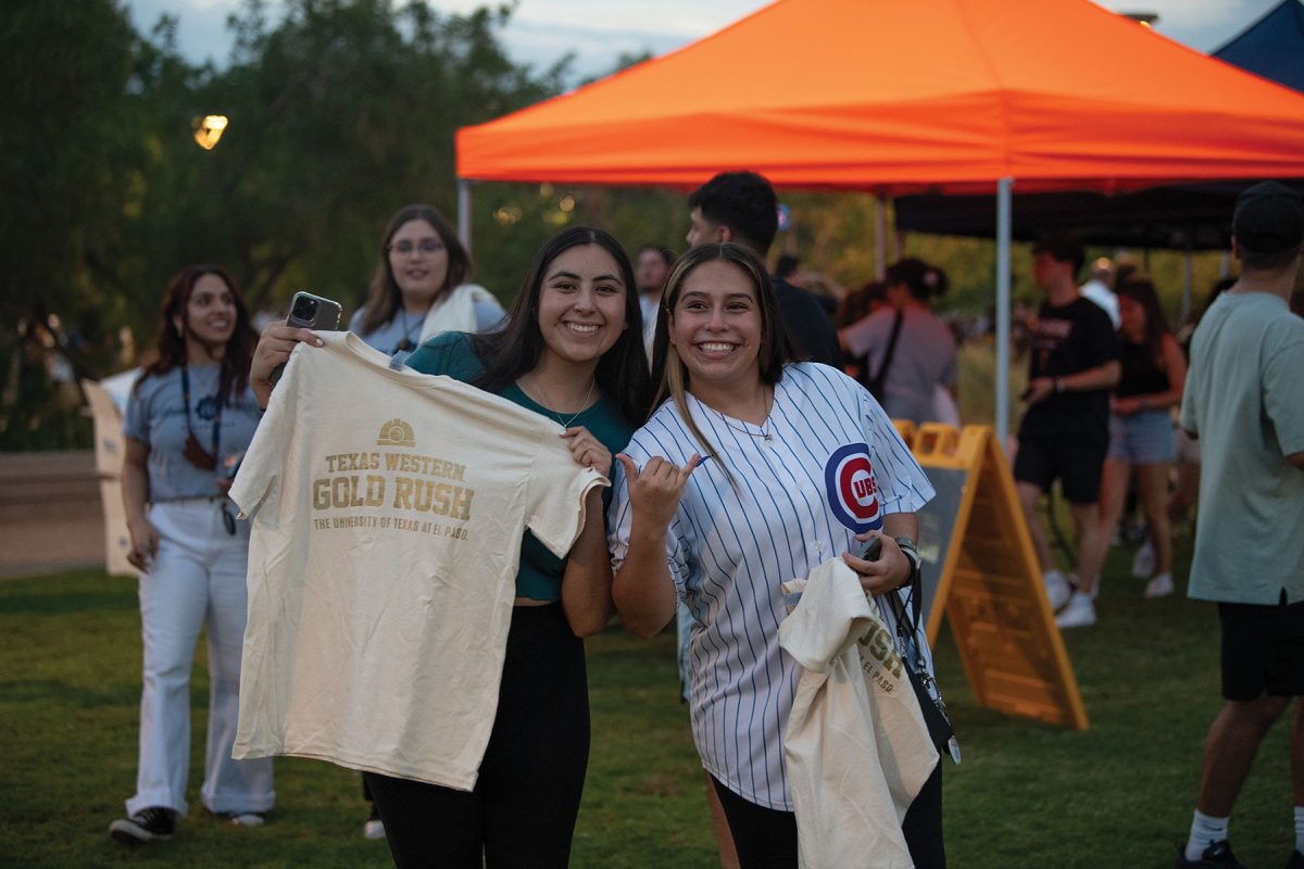 Students grabbing their T-shirts for Texas Western Gold Rush Aug. 28. 