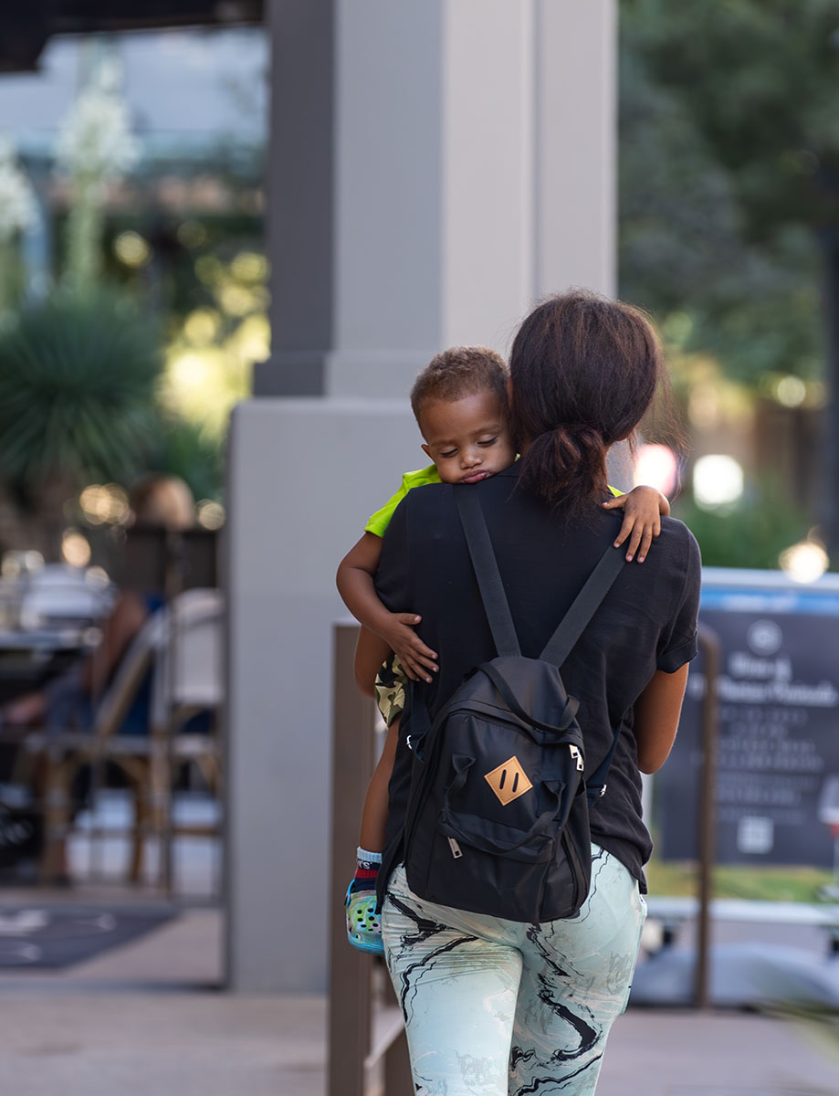 A mother carrying her son in downtown El Paso Sep. 22.