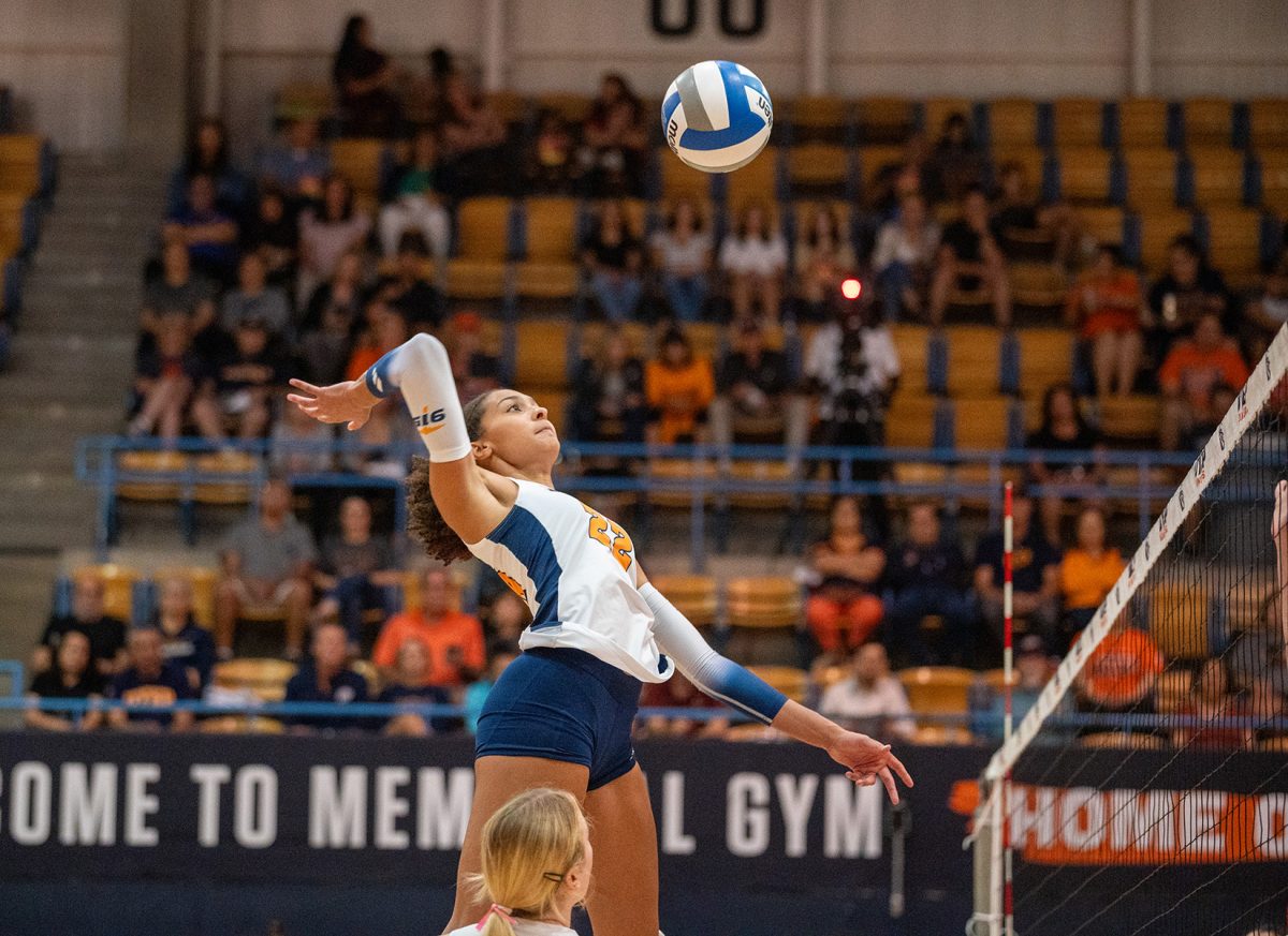 Middle+blocker+Danika+Washington+jumps+up+in+the+air+to+hit+the+ball+during+a+set+against+Jacksonville+State.+