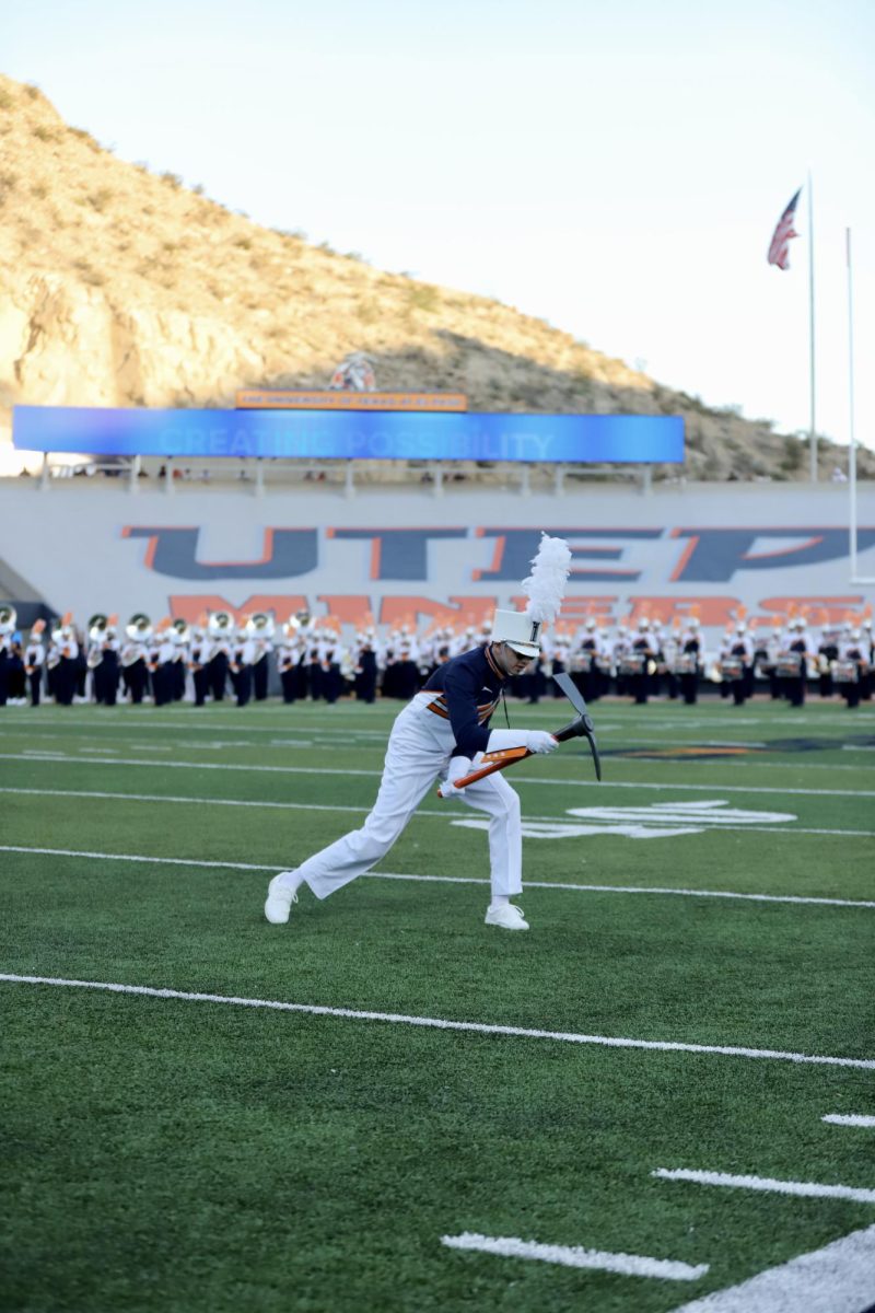 Drum Major Ramsey Perez leading the band to lift the Sun Bowl Stadium Saturday night on “Miner Magic”  