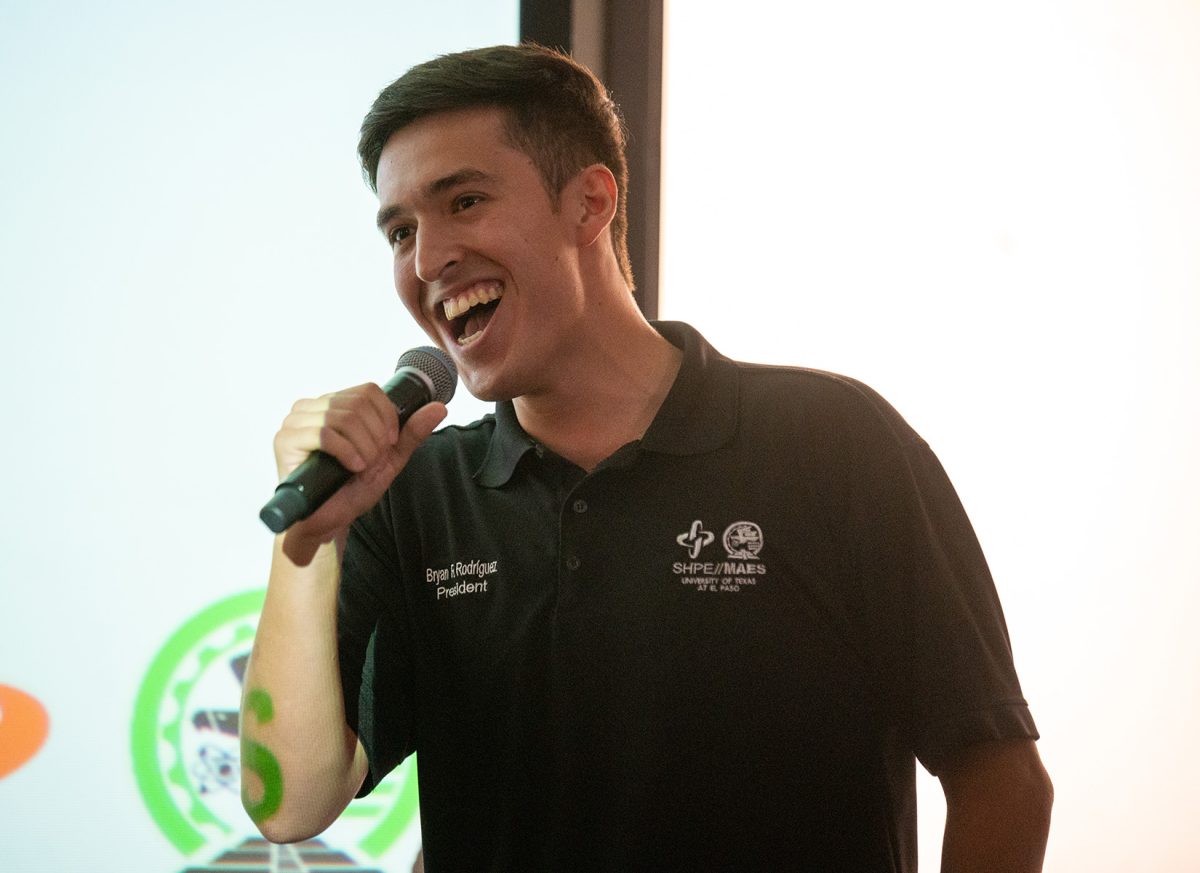 President of SHPE and MAES, Bryan Rodriguez, attempts to pump up the crowd in attendance. 