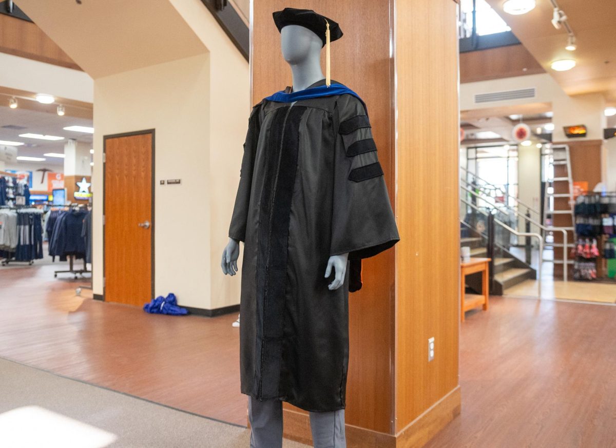 Regalia is the type of graduation coat that students wear for their graduate commencement.  