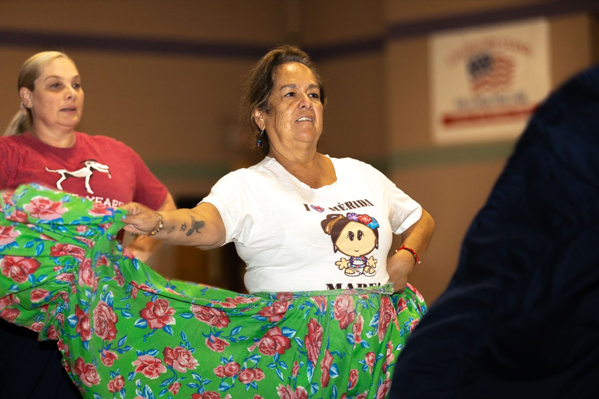 (From left to right) Tammy Robeson and Maria Vargas dancing to the song “La Llorona” at the REL Washington Elementary School gymnasium.
