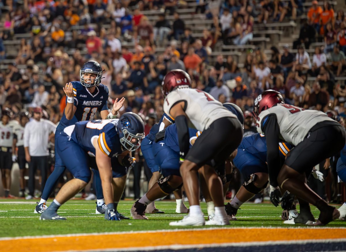 Quarterback Cade McConnell signals the offense prior to the snap, during a game against NMSU.  