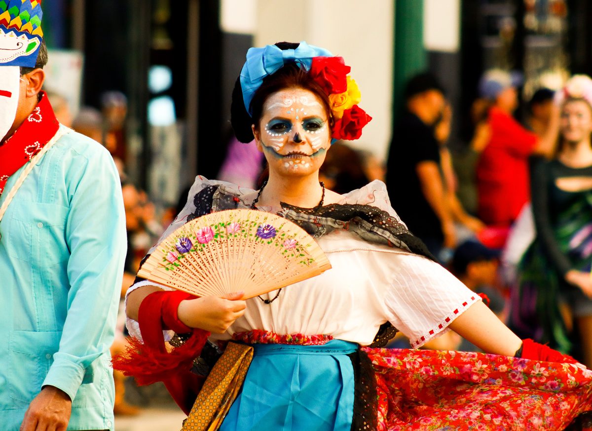 Skeleton dancers in Dia De Los Muertos parade.