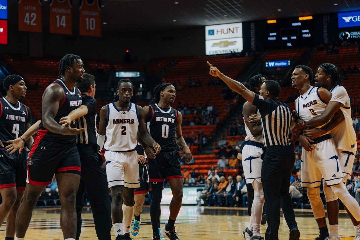Referees stop an altercation from happening between players from Austin Peay and UTEP. 