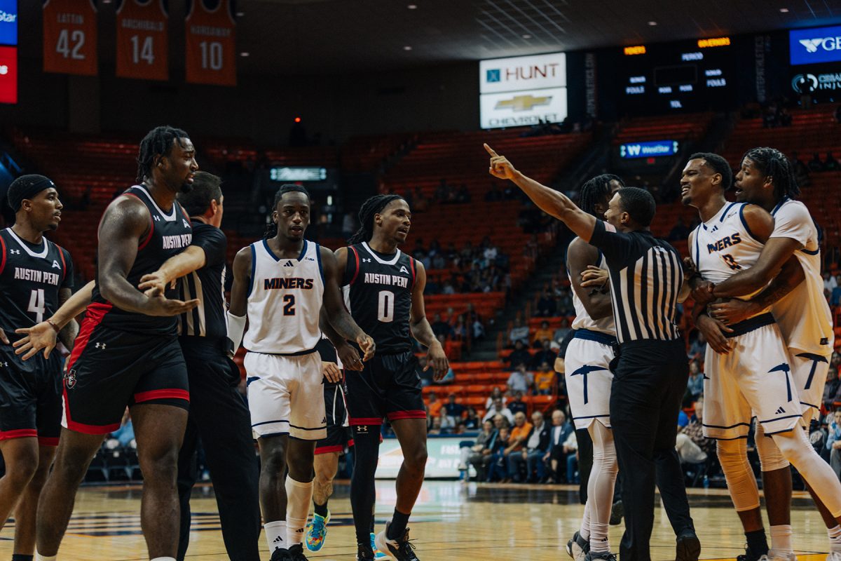 Referees stop an altercation from happening between players from Austin Peay and UTEP.