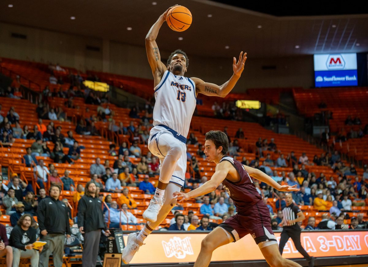 Forward Calvin Solomon prepares to dunk during a game against McMurry. 