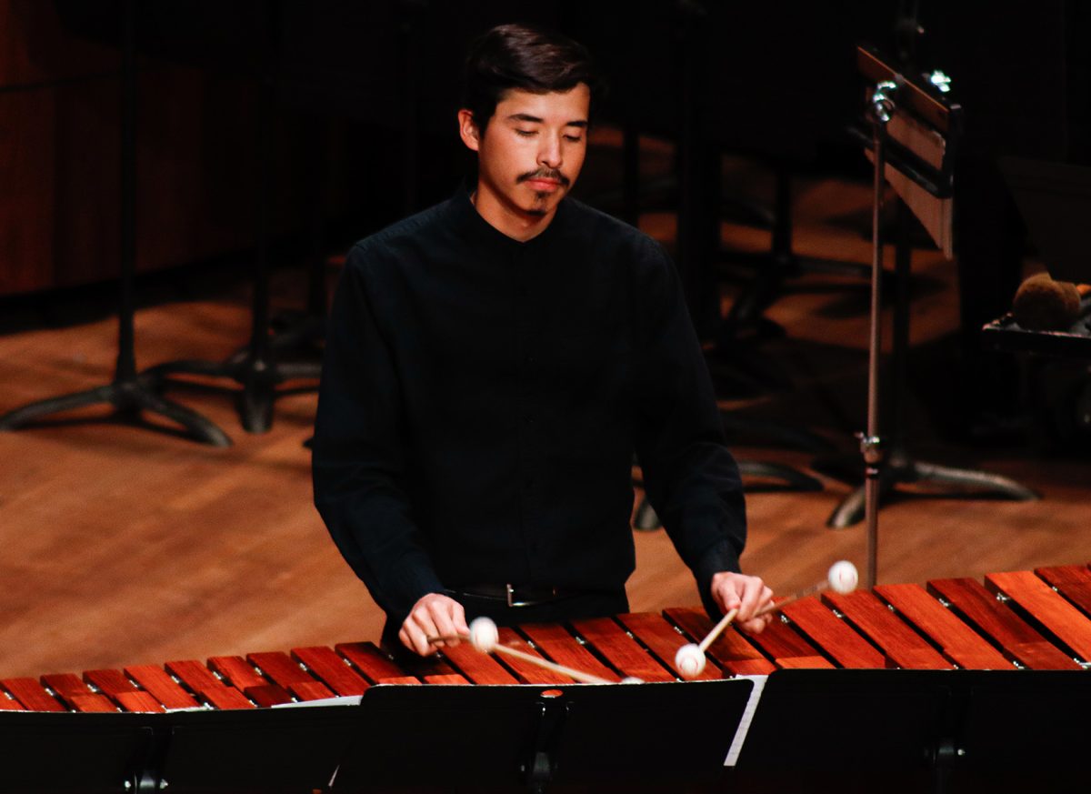 Miner plays the marimbas at Fox Fine Arts for final performance.