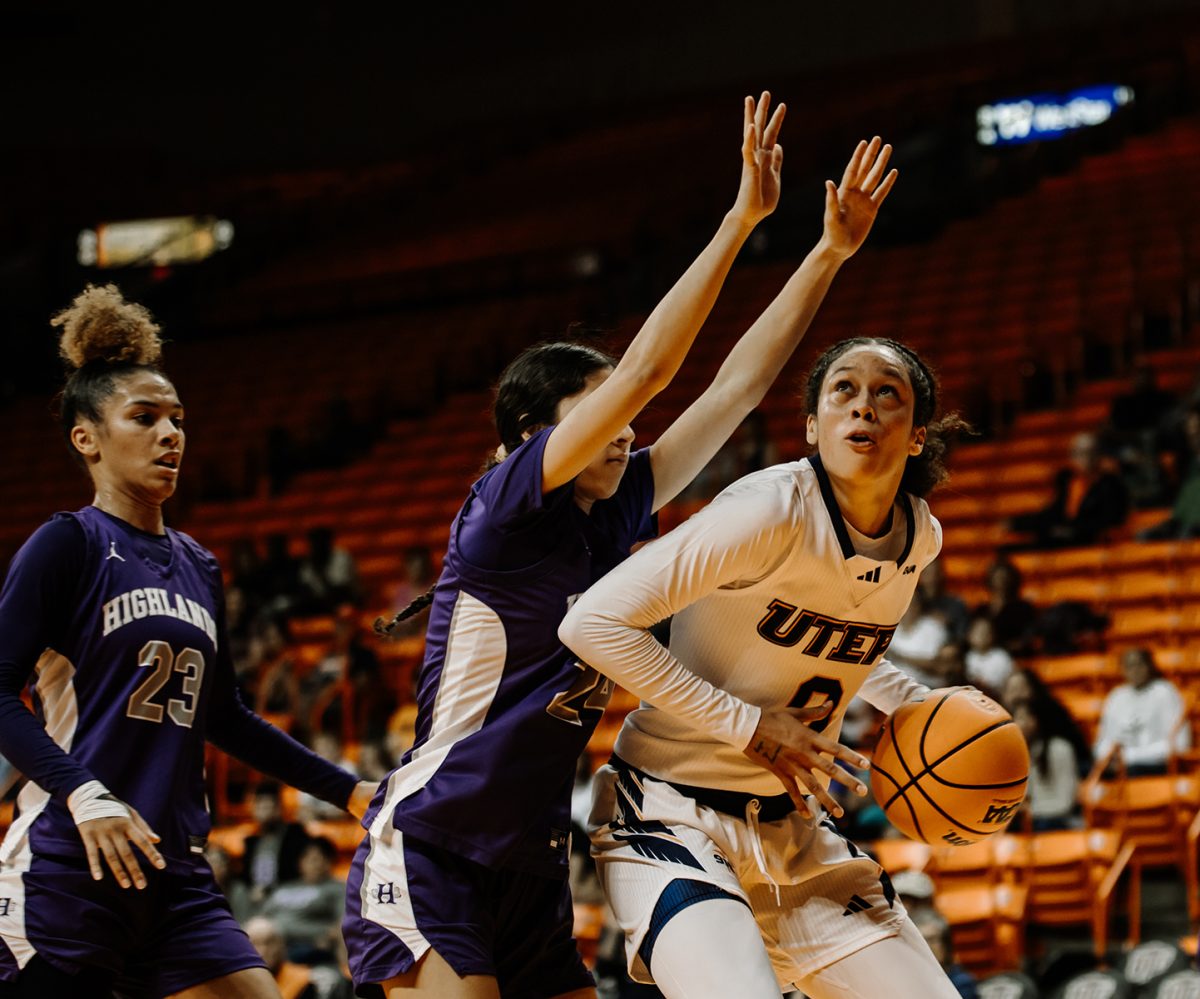 Guard Mahri Petree tries to make a basket against New Mexico Highland.