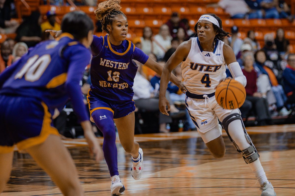 Guard Veonce Powell dribbles past Western New Mexico Nov. 6.  