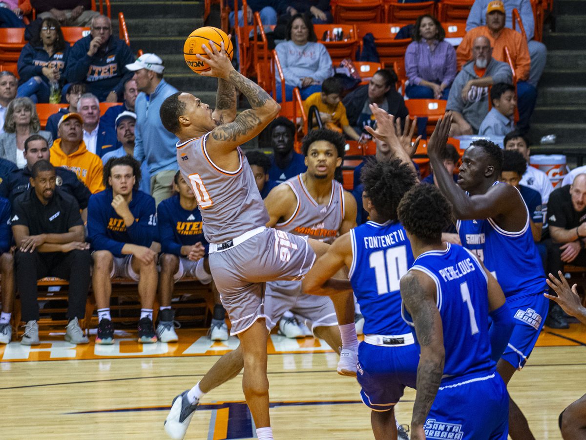 Guard Zid Powell attempts to shoot a scoring basket. 