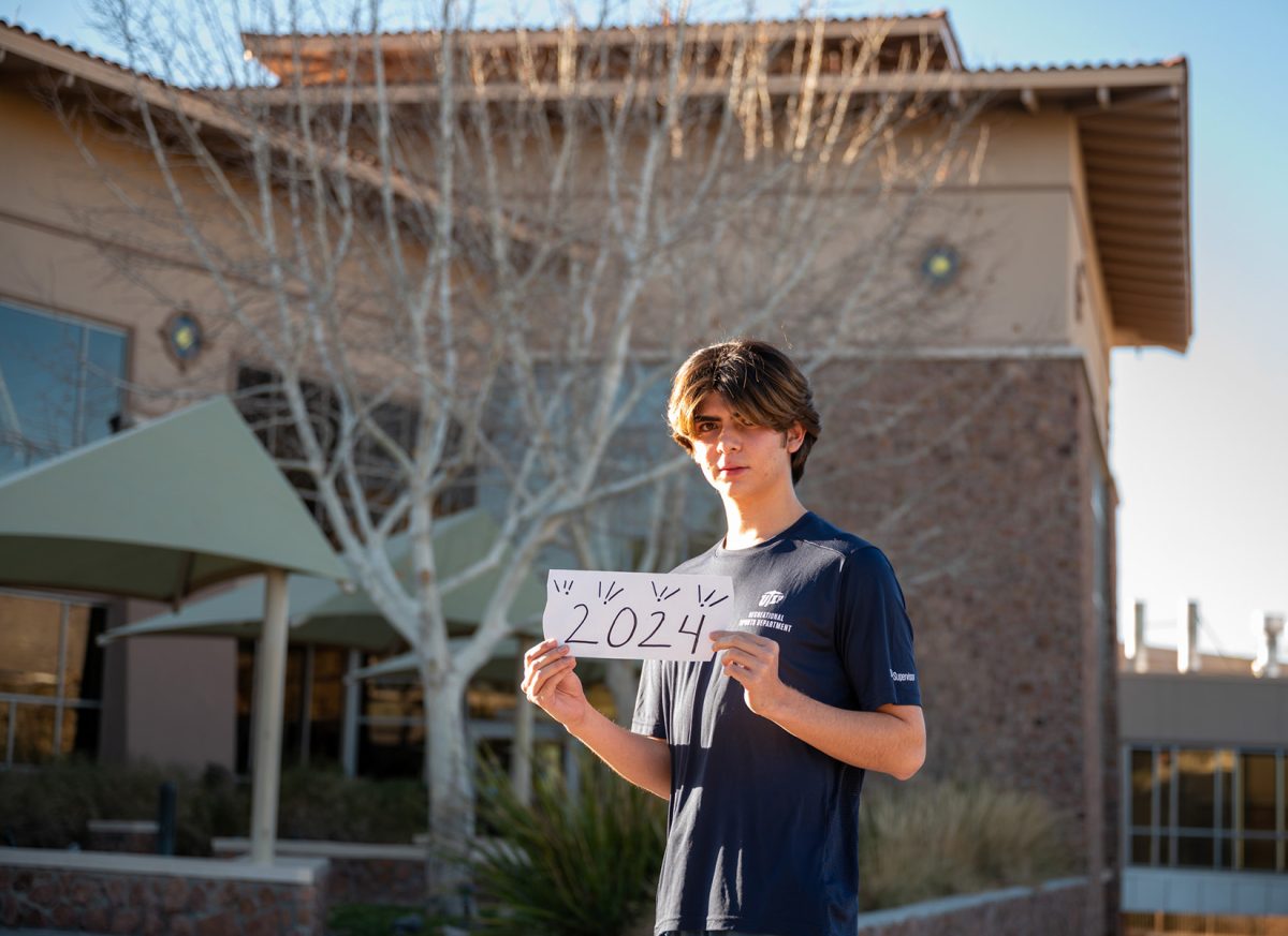 Junior Isaí Morga holds a sign that reads “2024” a year for them where 12 resolutions have been set. 