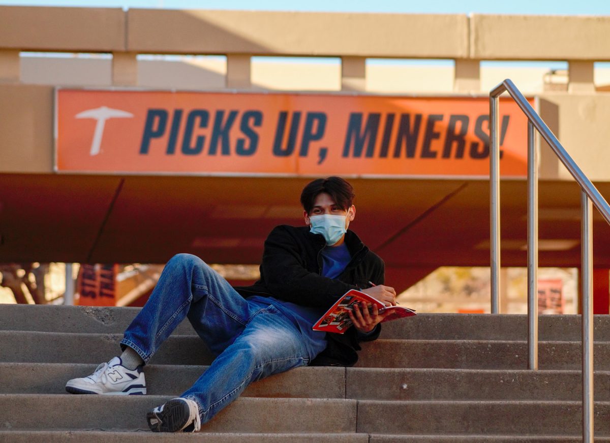 Benjamin Reyes relaxes on the steps of the Union taking a breather before the Spring semester.  