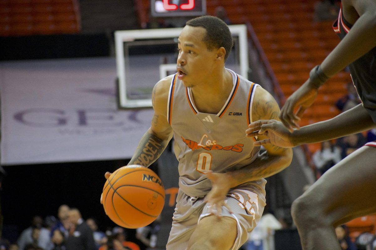 Forward Tae Hardy and Guard Trey Horton III sprint down the court in a race against the clock 