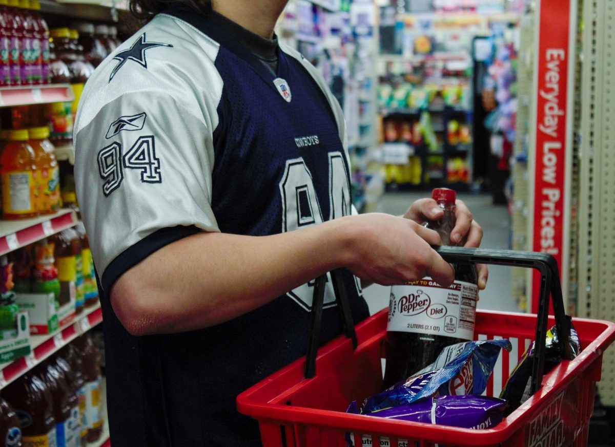 Filling his basket, Nicholas Sanchez preps for the big Super Bowl weekend with eagerness and excitement.  