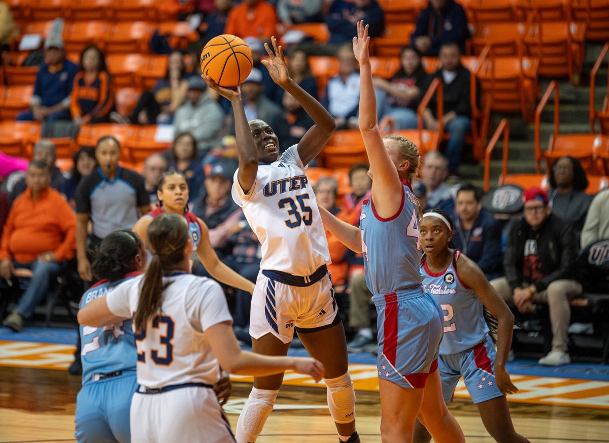 Foward Jane Asinde attempts to shoot the ball during a game on Jan. 25. 