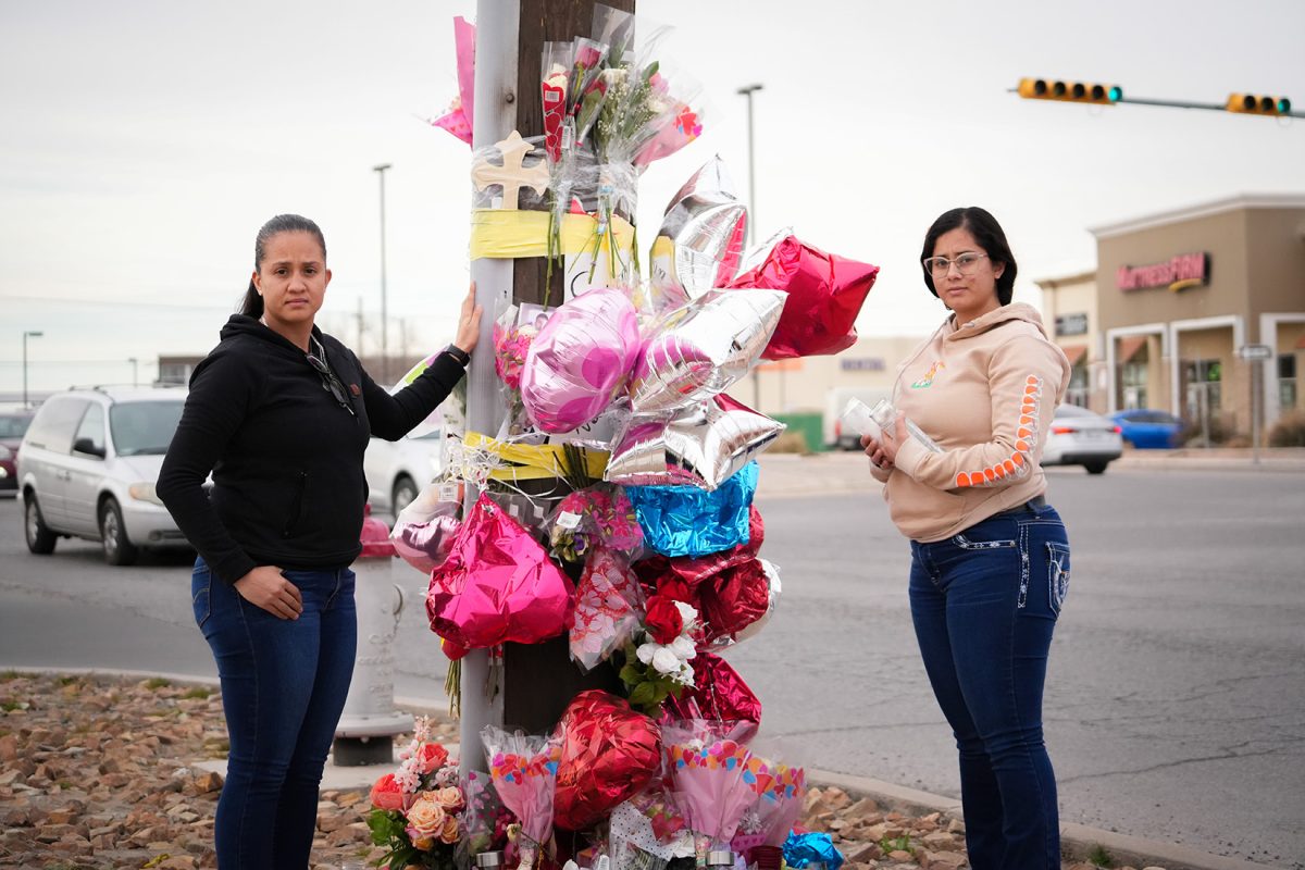 Miguel Romeros sisters making a memorial to their brother. 