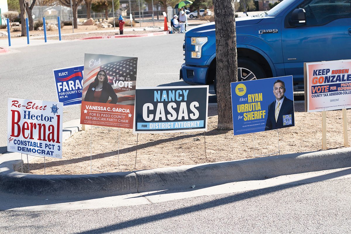 Candidates+display+signs+as+part+of+their+election+run.+