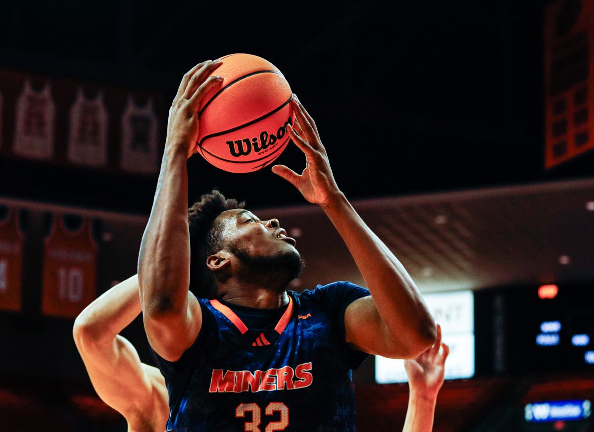 Junior forward Derick Hamilton attempts a layup.