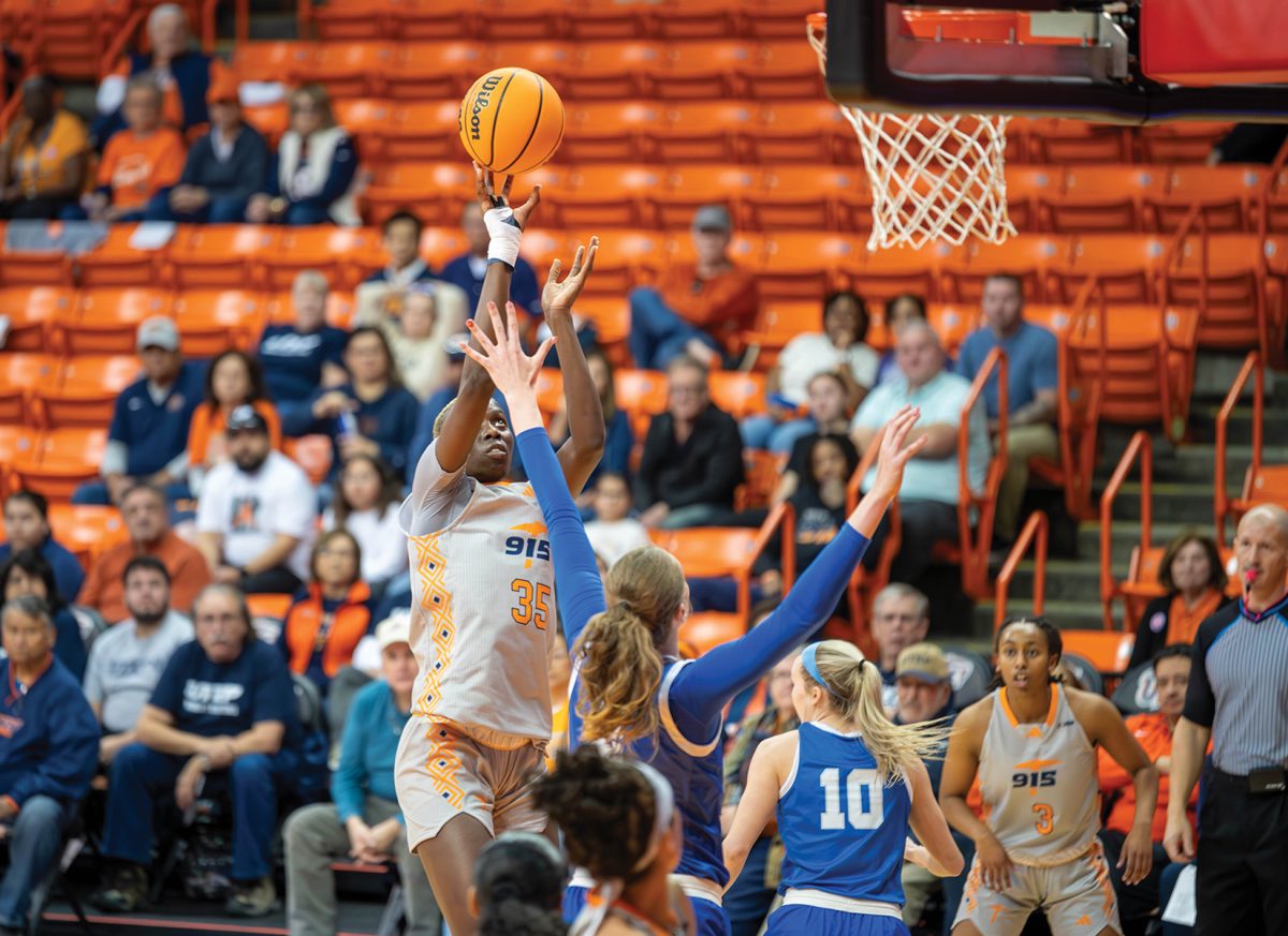 Forward Jane Asinde takes a jump-shot over the defense of a Middle Tennessee State player, Feb. 17. 