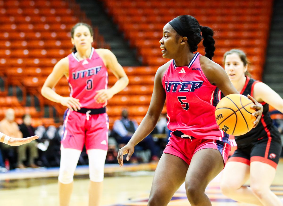 Junior guard Delma Zita looks to pass the ball. 