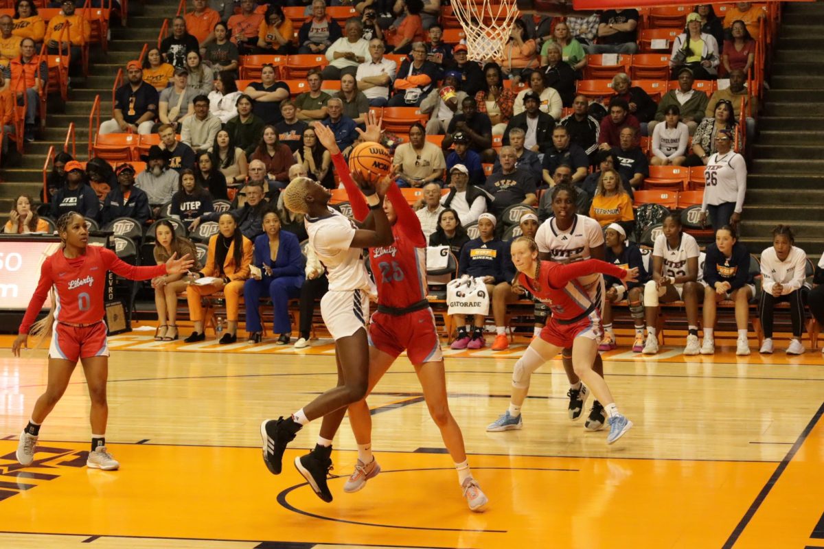 Senior forward Jane Asinde soars for a layup.