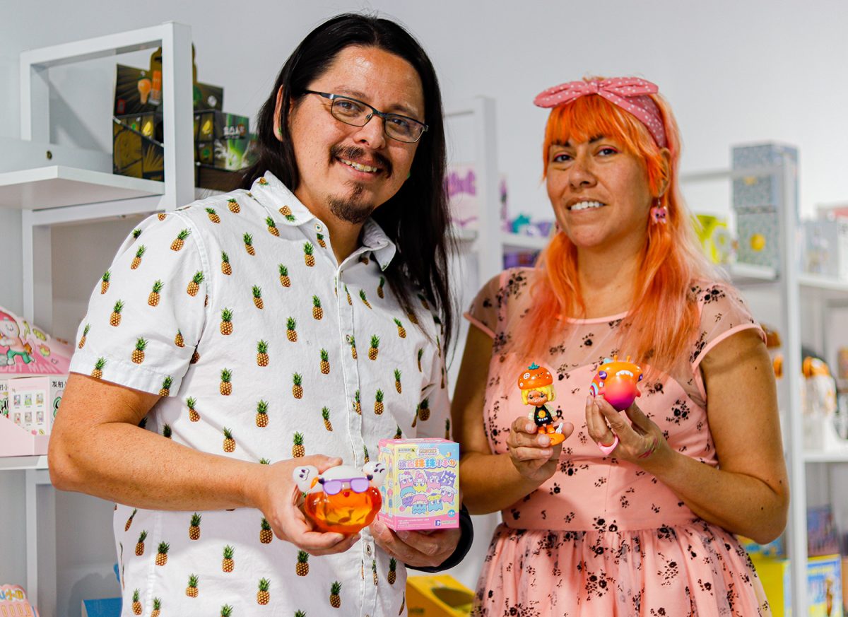 Gino Ybarra and Michelle Delgado showing off their favorite toys at their Ghost Fox Toy Store.