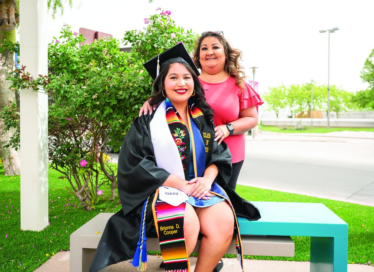 Brianna+Cooper%2C+with+the+help+of+her+mother+Sukie+Hernandez%2C+will+be+graduating+this+semester+and+hopes+to+attend+graduate+school+in+the+fall.