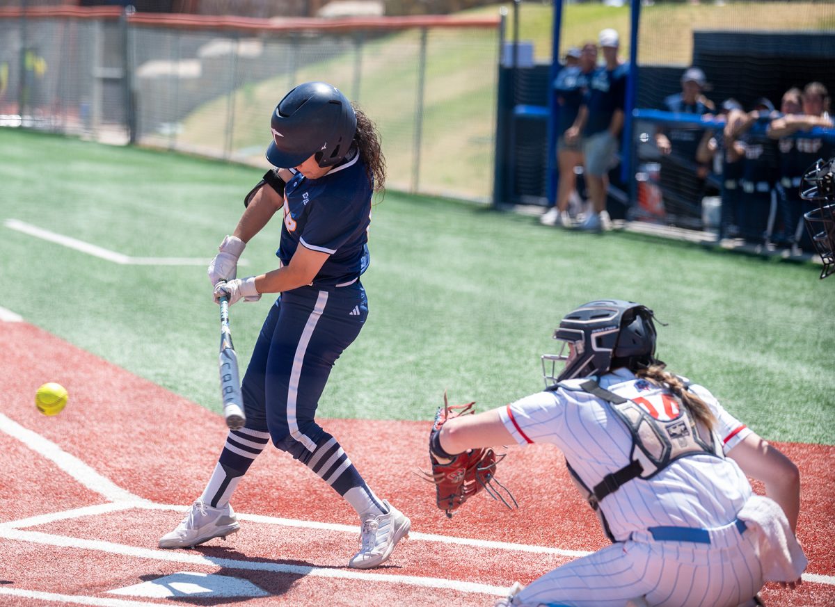 Outfielder Lexi Morales attempts to hit the ball during a game against Liberty, April 27.