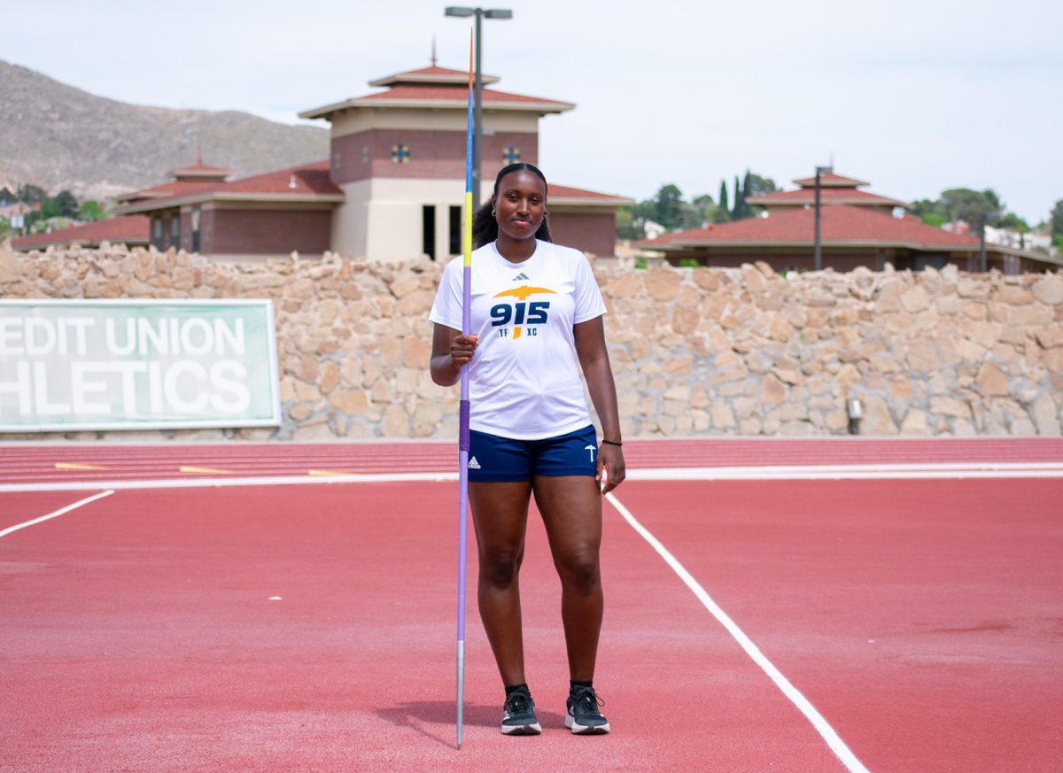 Senior Javelin thrower Arianne Morais readies her javelin to throw across the field.