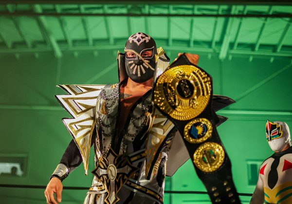 Lucha libre star Cinta de Oro, formerly known as Sin Cara, makes his entrance at The Ides of March event at the Boys & Girls Club on Mar. 22, captivating the crowd with his signature presence.