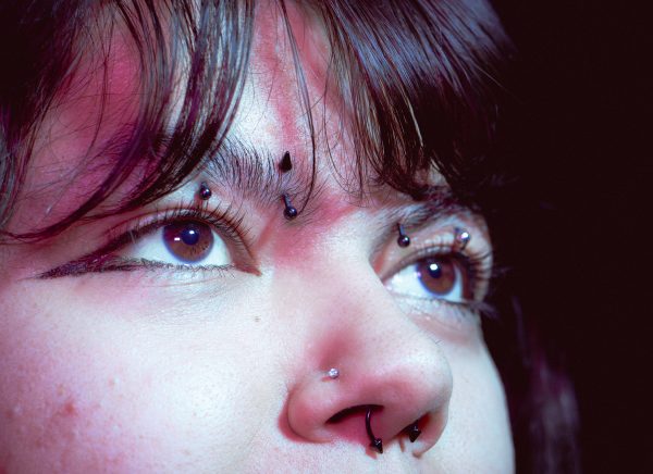 In today's age, it is more common to express oneself through different types of piercings and tattoos.