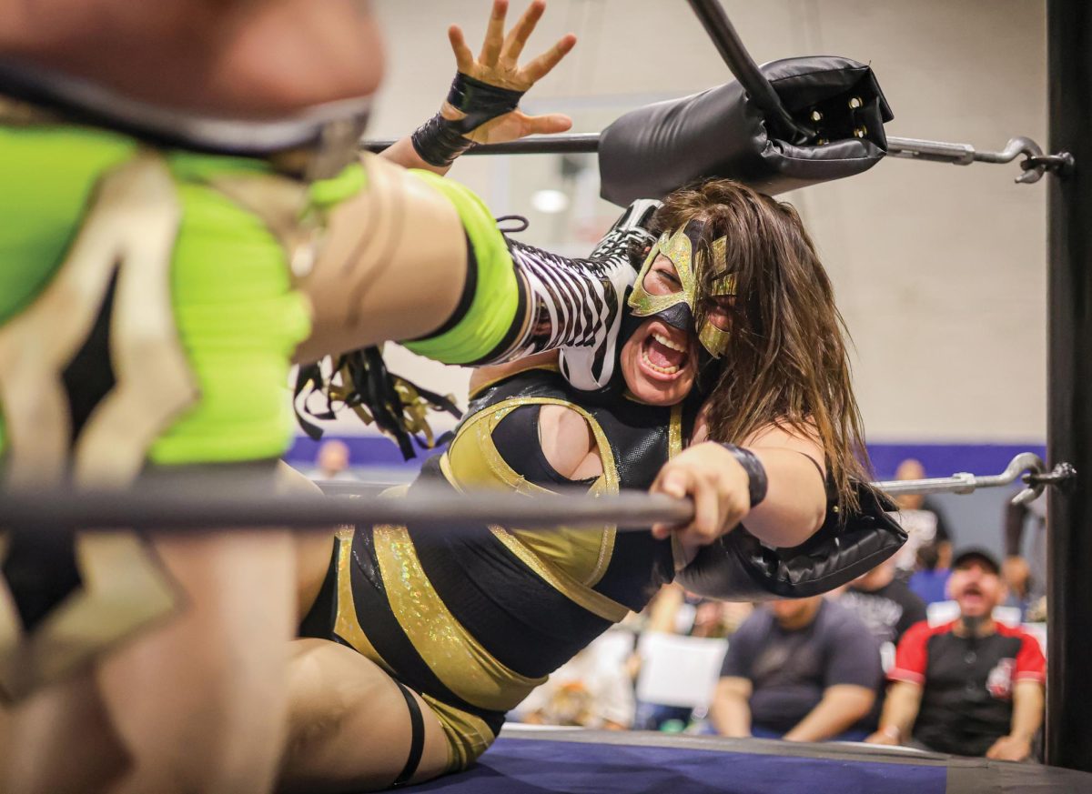 Fighting for the IOCW Women's world Championship, Sakura suffers punishment from Miss Kath in the Boys and Girls Club of El Paso on April 15.