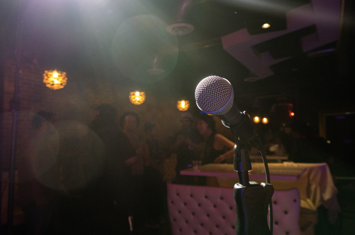 The microphone sits in front of a mingling crowd at El Paso BWOMS’ open mic event at Proof & Press on Wednesday, July 9. 