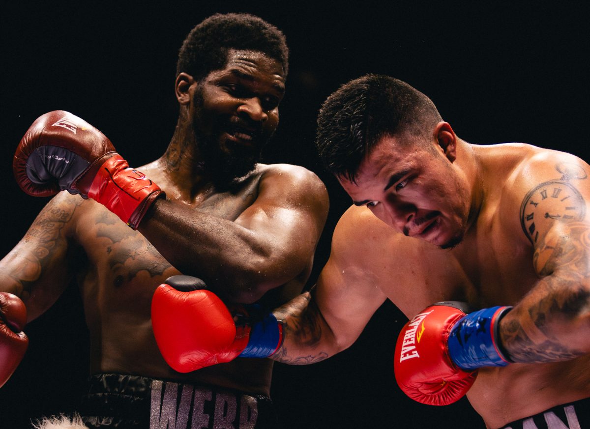 Dallas boxer Vercell Webster and El Paso boxer Marcos Duran fight in the heavyweight matchup during the Kings Promotions Ring Wars boxing match at the El Paso County Coliseum. 