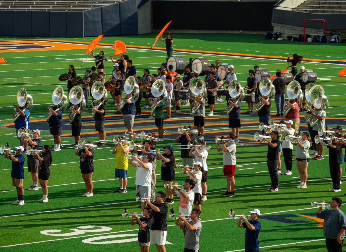 UTEP’s Marching Miners rehearse before the first football home game of the semester. The student ensemble consists of brass, woodwind, and percussion instrument players, alongside the Diamond Colorguard and the Golddiggers Dance Team.  