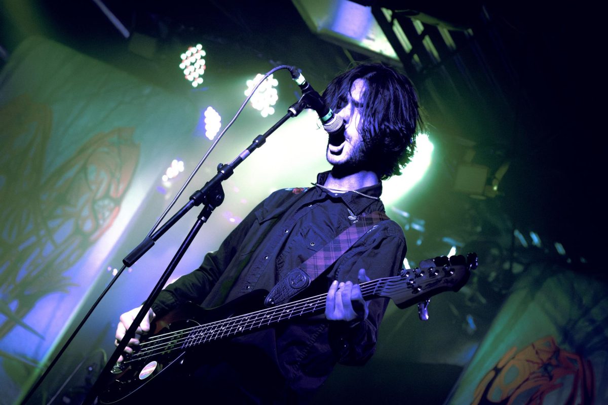 Dierks Canada, lead screamer, performs while playing bass and guitar during a Waves in April show in El Paso on Feb. 27.